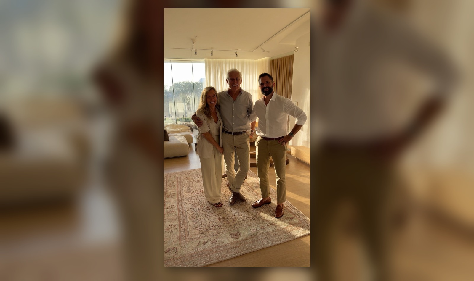 Clients photographed in a sunlit room with a rug
